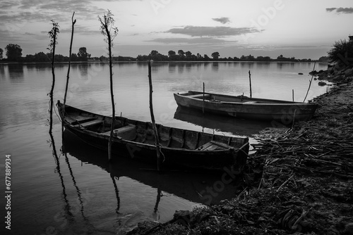 sunrise with boats on the lake