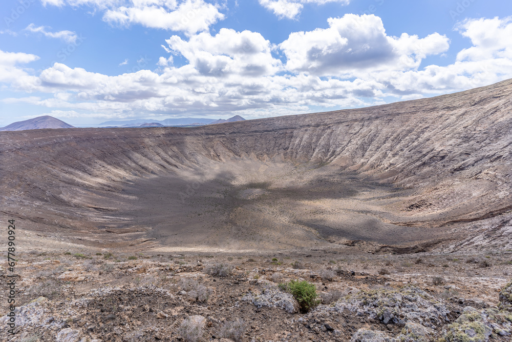 Lunar Volcanic landscape, Fire Mountains, volcanoes, crater of the Caldera Blanca volcano, Lanzarote, Canary Islands, Spain Lunar Volcanic landscape, Fire Mountains, volcanoes, crater of the Caldera Blanca volcano, Lanzarote, Canary Islands, Spain