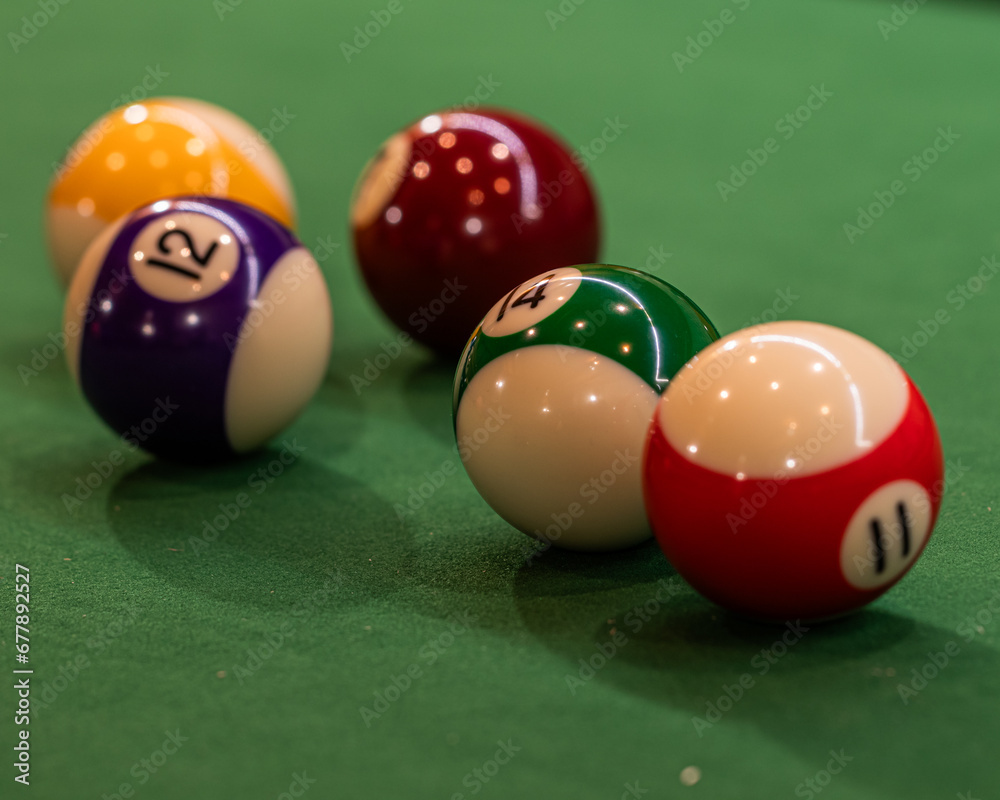 Close-up of a pool table with vibrant billiard balls, inviting a game of precision and skill Close-up of a pool table with vibrant billiard balls, inviting a game of precision and skill