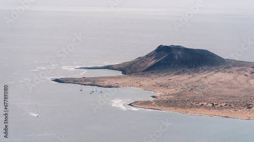 Panoramic full view of la Graciosa island as seen from lanzarote, canary islands, spain, view of the volcano, part of the Chinijo Archipelago and the Chinijo Archipelago Natural Park photo