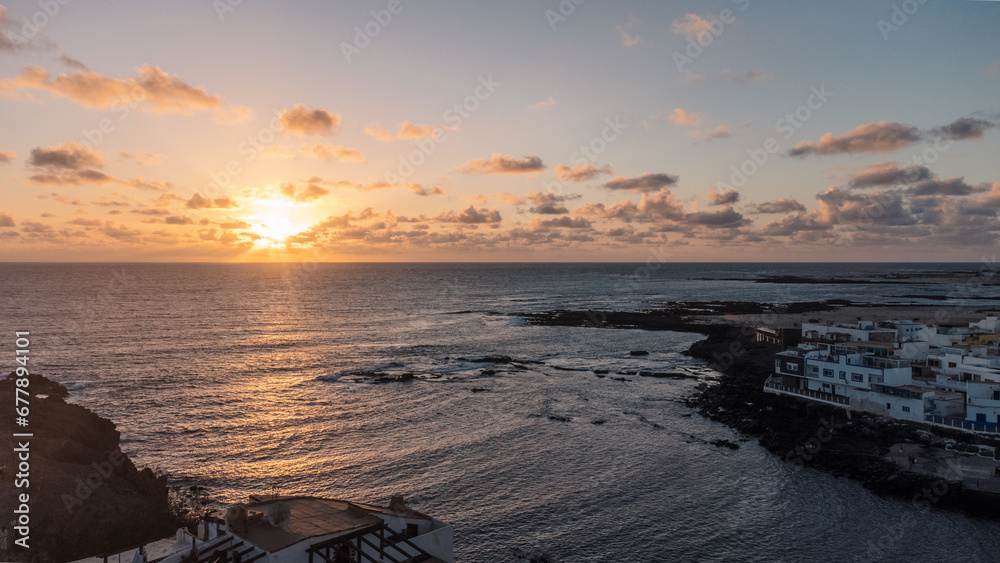 Sunset on the ocean background in el cotillo, fuerteventura, Canary islands, spain