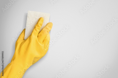 Hand holding duster cloth for cleaning