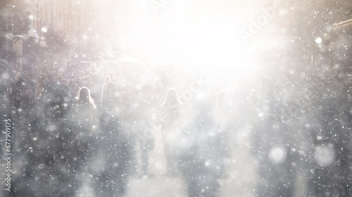 winter background snowfall in the city, copy space abstract blurred white background snowflakes falling on a crowd of people © kichigin19