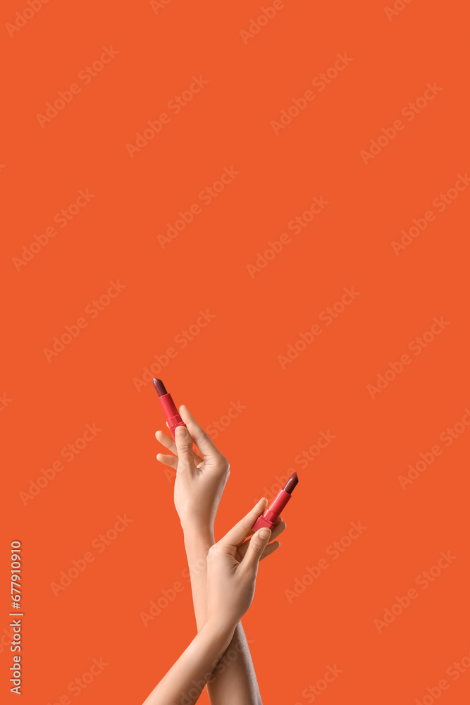 Woman with lipsticks on red background Woman with lipsticks on red background