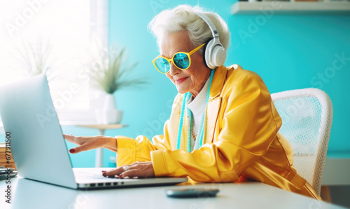 Cool happy grandmother  with laptop
