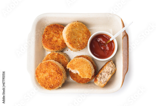 Baking dish of tasty meat cutlets on white background