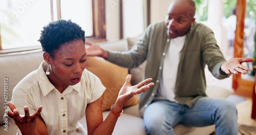 Frustrated black couple, fight and conflict on sofa in argument, disagreement or ignore at home. African man or woman in toxic relationship, breakup or cheating affair in living room divorce at house photo
