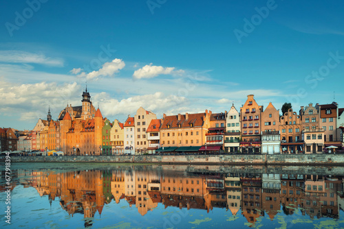 Cityscape of Gdansk with reflection under blue sky with clouds.