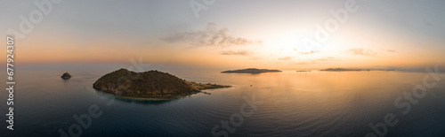 Tropical islands at sunset, beautiful aerial panoramic drone shot © Simon