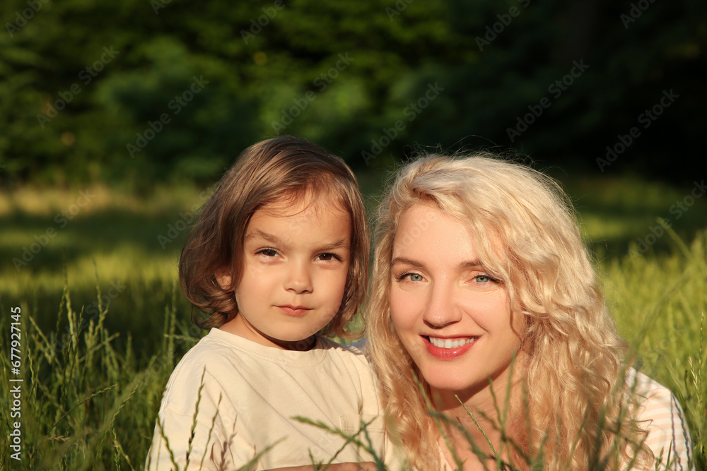 Happy mother with her cute daughter spending time together outdoors Happy mother with her cute daughter spending time together outdoors