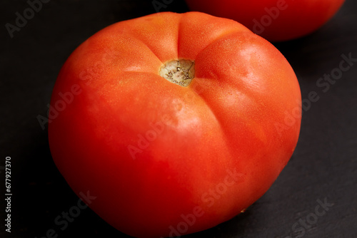 Fresh ripe red tomato. Vegetable, cooking ingredient photograph.
