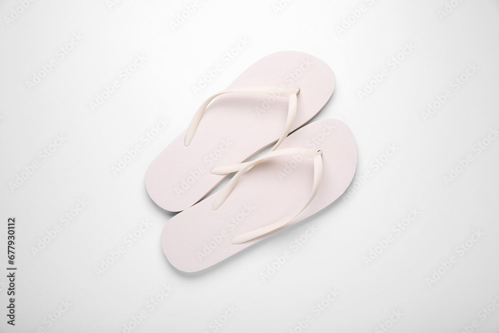 Stylish flip flops on white background, top view Stylish flip flops on white background, top view