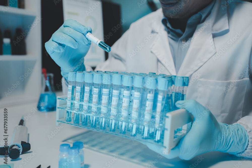 Chemist is chemically analyzing test tubes, Scientist is experimenting with chemicals in the laboratory, Chemist is separating compounds in test tubes with chemical reagents. Chemist is chemically analyzing test tubes, Scientist is experimenting with chemicals in the laboratory, Chemist is separating compounds in test tubes with chemical reagents.