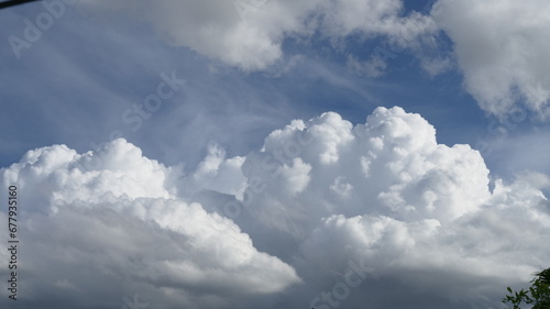 Quadro su tela Blue sky fluffy white clouds on summer season bright clear skyline with beautiful cloudscape