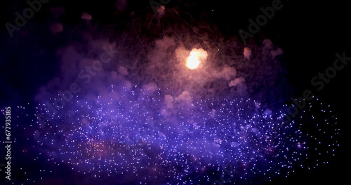 Purple Firework celebrate anniversary happy new year 2024, 4th of july holiday festival. Purple firework in night time celebrate national holiday. Violet firework Countdown to new year 2024 festival © aFotostock
