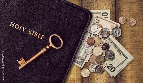 Obraz na plátně Holy Bible book and money coins