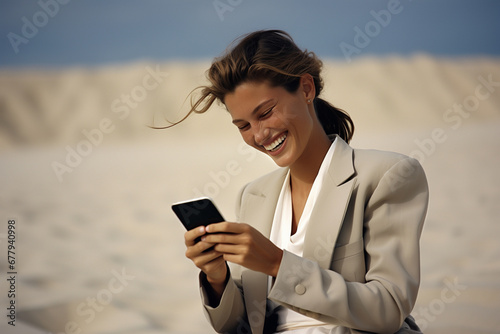 happy smiling elegant woman with mobile phone on beach