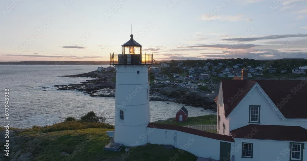 Aerial Drone shot of York Beach Maine flying over Cape Neddick Nubble Lighthouse into the Sunset Aerial Drone shot of York Beach Maine flying over Cape Neddick Nubble Lighthouse into the Sunset