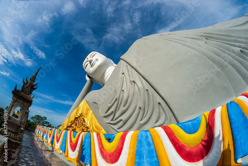 Giant cement reclining Buddha pagoda in Soc Trang province, Vietnam photo