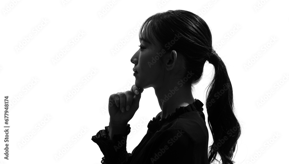 考える女性の横顔のシルエット 考える女性の横顔のシルエット
