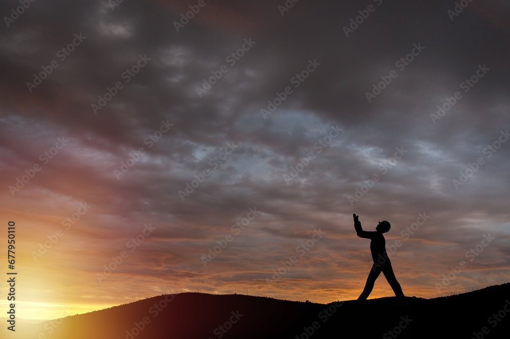 Fototapeta premium Person on sunset sky with number 2024 background.