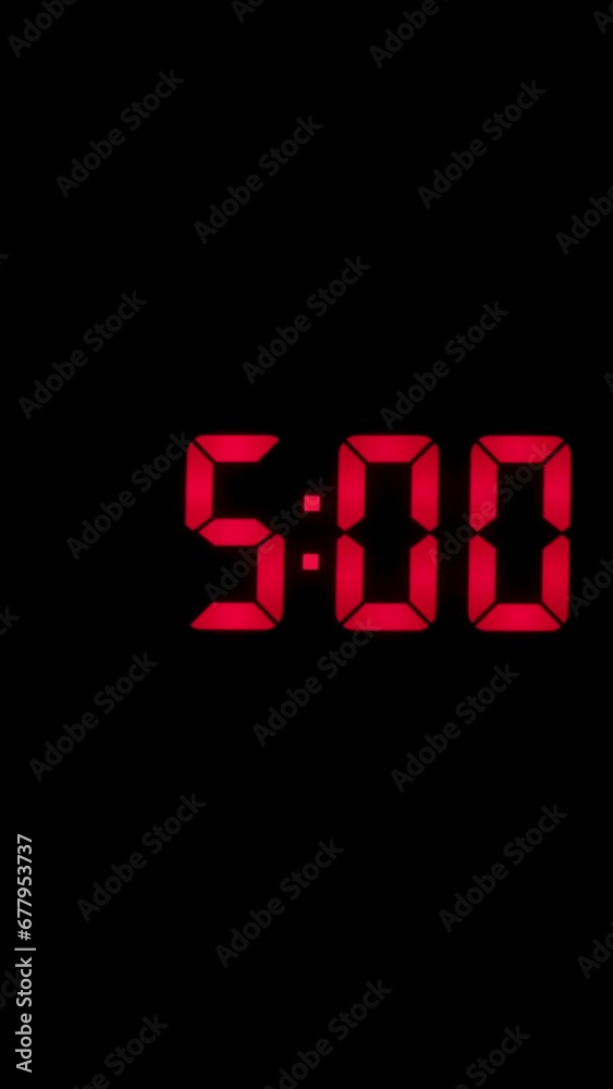 Vertical time lapse of a digital alarm clock time passing over a day to night. Vertical time lapse of a digital alarm clock time passing over a day to night.