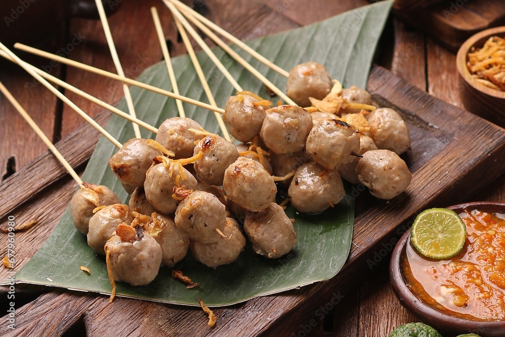 Fototapeta premium Sate taichan is a variation of chicken satay grilled and served without peanut or ketjap seasoning unlike other satays. It is served with sambal and squeezed key lime,