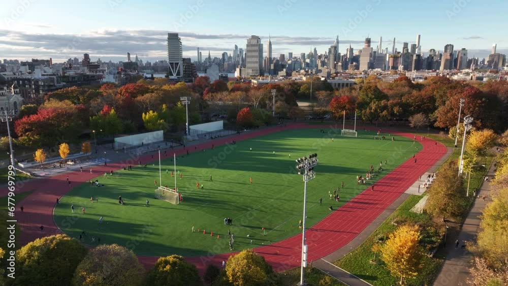 Drone shot of Greenpoint, Brooklyn's McCarren Park on an autumn afternoon. Drone shot of Greenpoint, Brooklyn's McCarren Park on an autumn afternoon.