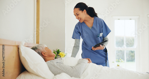 Happy woman, nurse and tablet with patient in bed, elderly care or checkup at old age home. Female person, doctor or medical caregiver smile with technology and client lying in bedroom for healthcare