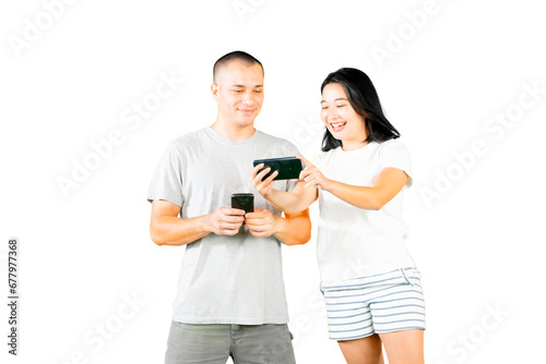 Happy young caucasian - asian couple using mobile phone © Creativa Images
