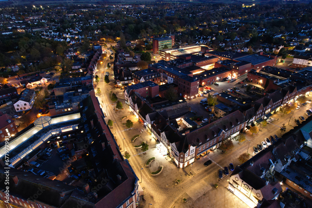 Fototapeta premium Beautiful High Angle Footage of Illuminated Central Letchworth Garden City of England UK. The Footage Captured with Drone's Camera on November 11th, 2023 at Just After Sunset and During Night