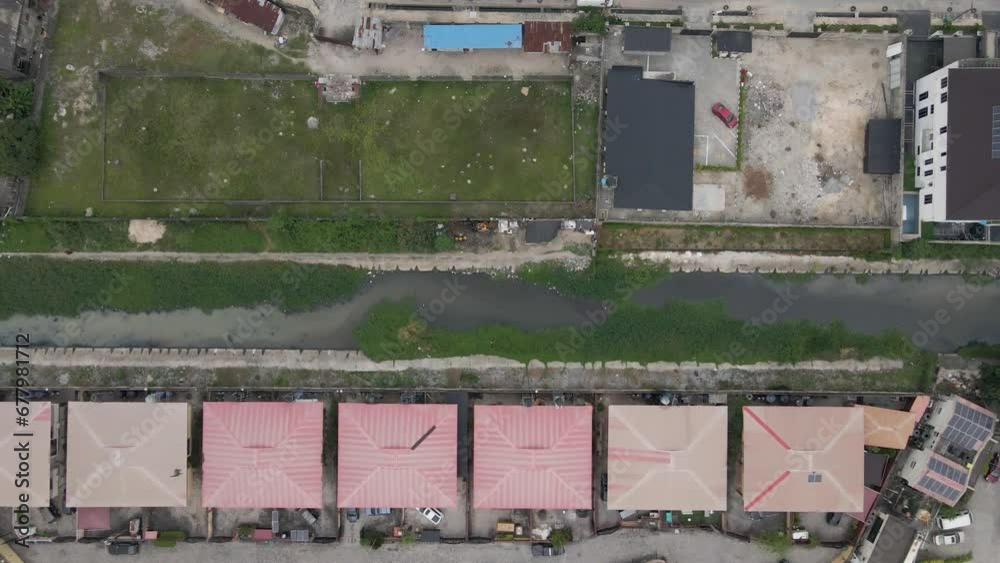 An enchanting straight-down drone view of a canal in Lekki, Lagos, Nigeria. An enchanting straight-down drone view of a canal in Lekki, Lagos, Nigeria.