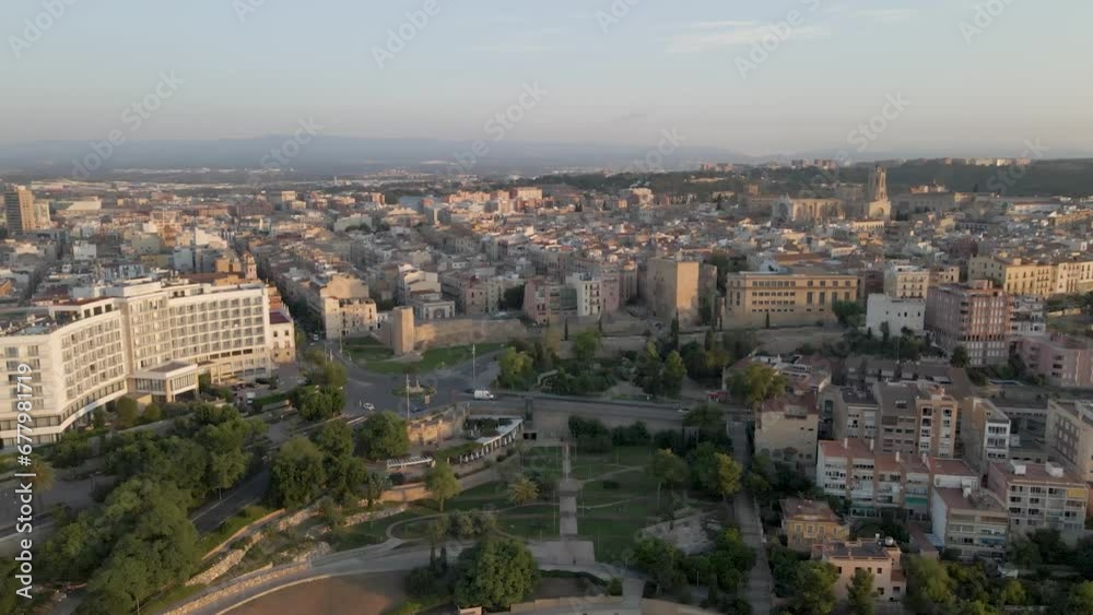 A picturesque slow drone approach to the morning cityscape of Tarragona, Spain, showcasing the Tarragona Cathedral A picturesque slow drone approach to the morning cityscape of Tarragona, Spain, showcasing the Tarragona Cathedral