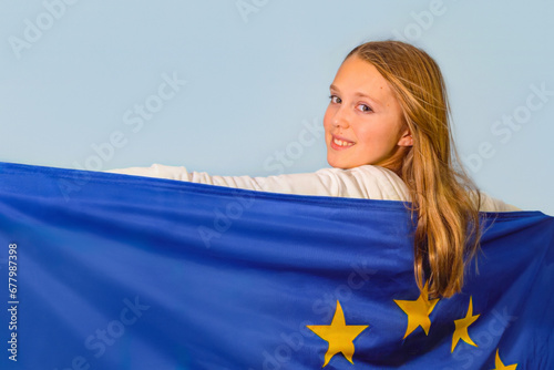 Girl 10-12 years old with the flag of the European Union. Portrait, close-up