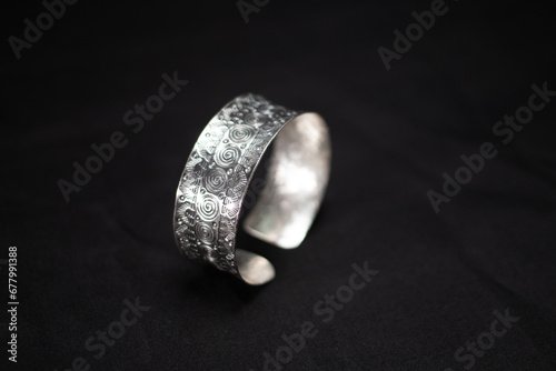 Foto Hmong silver jewelry on black background, Handmade silver accessories