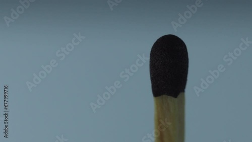 macro on igniting a matchstick, whose flame goes out, and burns.
 photo