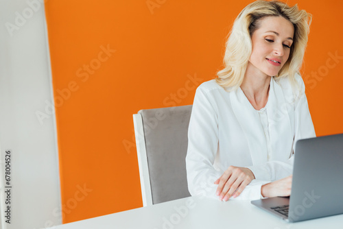 Business Woman Secretary Working Online With Laptop Computer In Office