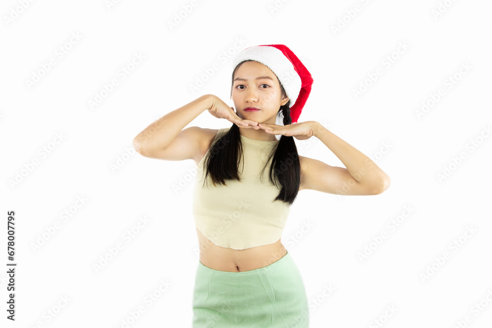 portrait of asian teenag girl wears a christmas red santa claus hat isolated on white background portrait of asian teenag girl wears a christmas red santa claus hat isolated on white background