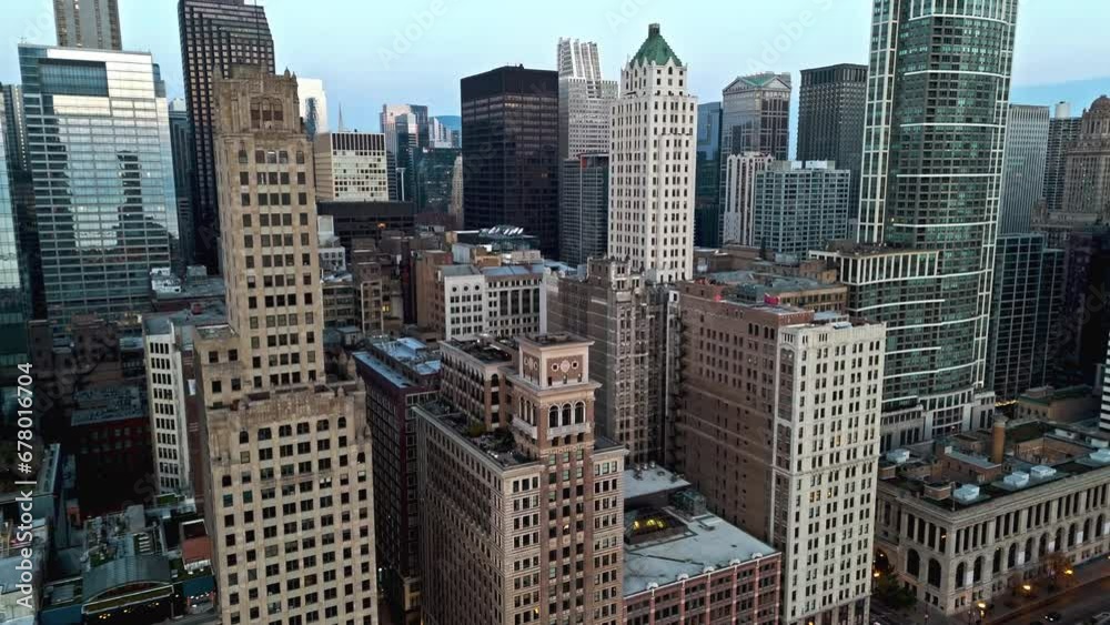 Aerial view tilting toward high-rise in Loop, autumn evening in Chicago, USA Aerial view tilting toward high-rise in Loop, autumn evening in Chicago, USA