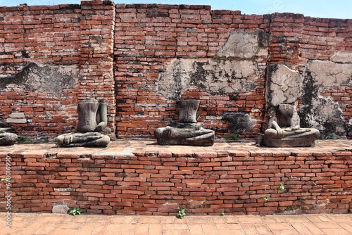 Wallpaper Mural Headless Buddha statue in Thailand ancient temple with historical brick wall background Torontodigital.ca
