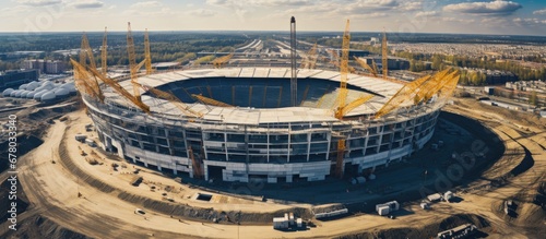 Constructing new football stadium with aerial view of building site Copy space image Place for adding text or design photo
