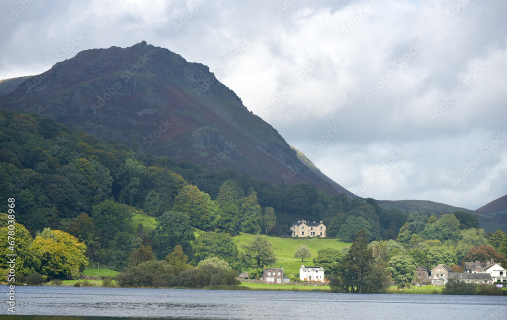The slopes of Helm Crag above the shore of the lake at Grasmere in the Lake District