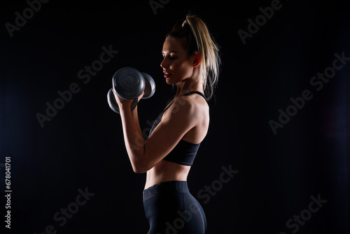 Fitness, workout and woman with weights in a studio for a arm or strength training with motivation.