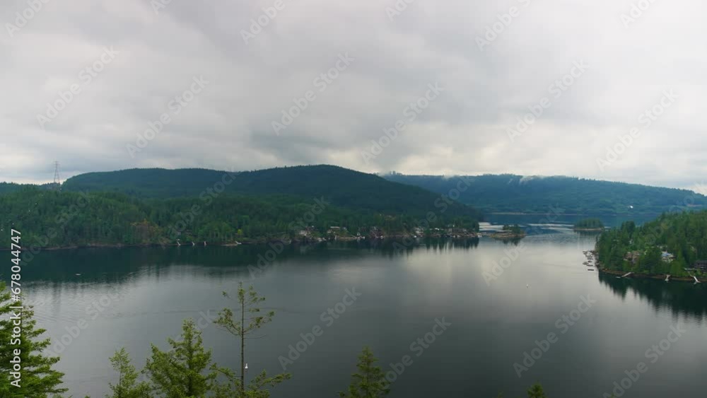 Panning View Of Lake and Forest Hills From Quarry Rock in Deep Cove, Vancouver, British Columbia, Canada. - wide pan Panning View Of Lake and Forest Hills From Quarry Rock in Deep Cove, Vancouver, British Columbia, Canada. - wide pan