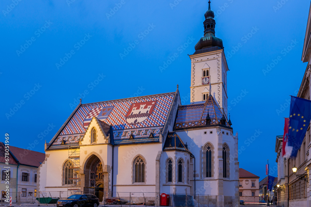 Obraz premium Zagreb, Croatia 10-9-2023 St. Mark is the parish church of old Zagreb, located in St. Mark's square and the oldest architectural monument in town, the roof tiles are the coat of arms of Croatia