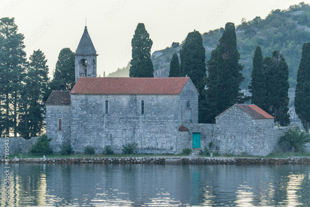Close view of the church bell tower and islands in the town of Perast in the Bay of Kotor Montenegro