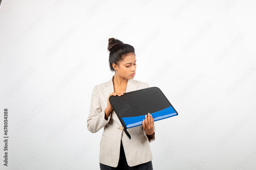 Corporate office lady holding a folder and giving presentation. Young woman in formal wear wearing white blazer giving different expressions with a folder in her hand