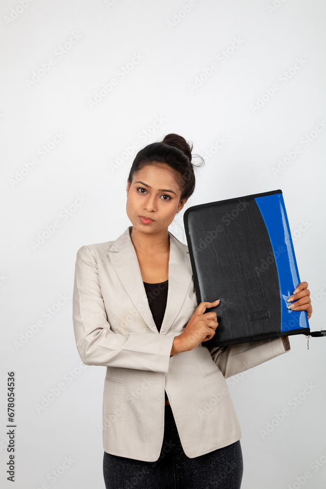 Corporate office lady holding a folder and giving presentation. Young woman in formal wear wearing white blazer giving different expressions with a floder in her hand Corporate office lady holding a folder and giving presentation. Young woman in formal wear wearing white blazer giving different expressions with a floder in her hand