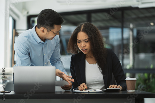 business people, teamwork, people and crisis concept - team data analysts and solving problems in the office