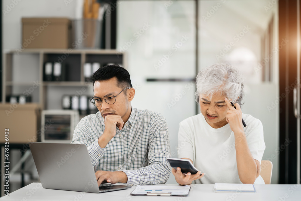people sad entrepreneur is sitting at table, small online business owner, Stress and crisis concept. people sad entrepreneur is sitting at table, small online business owner, Stress and crisis concept.